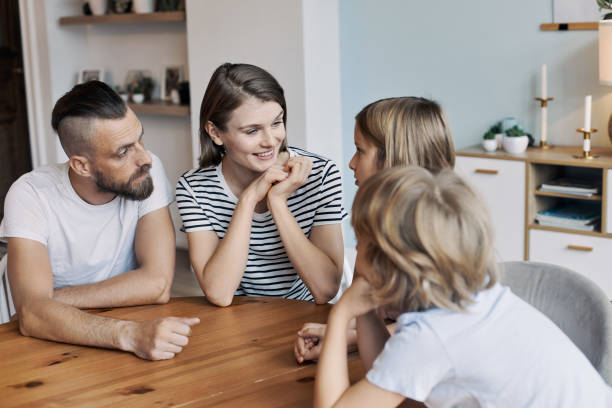 Parent helping child with communication skills during playtime